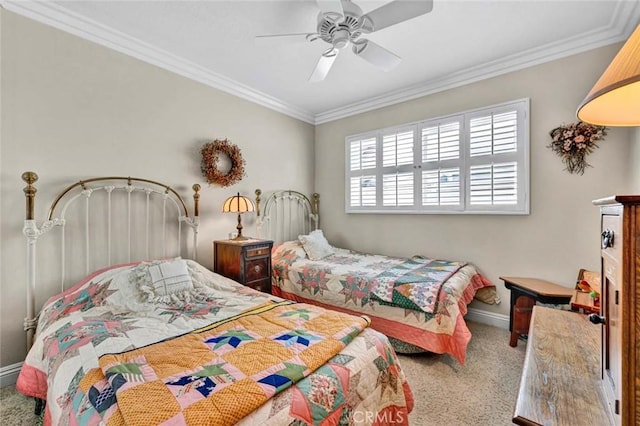 bedroom with ceiling fan, crown molding, carpet flooring, and baseboards