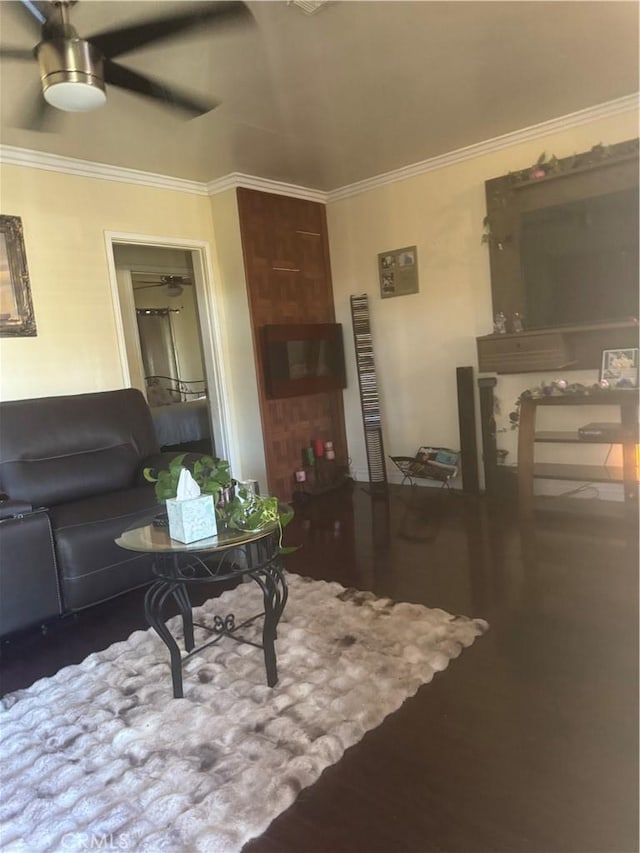 1301 E 106th St, Los Angeles, CA 90002 - living room with wood finished floors, a ceiling fan, and ornamental molding