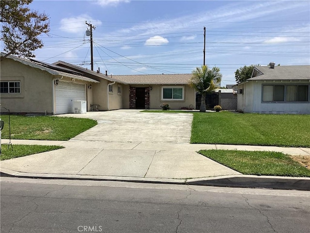 822 Greenberry Dr, La Puente, CA 91744 - ranch-style house with concrete driveway, a front yard, stucco siding, and an attached garage