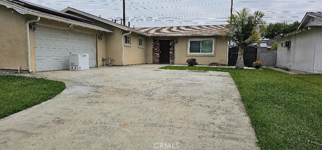 822 Greenberry Dr, La Puente, CA 91744 - view of front facade with stucco siding, concrete driveway, and an attached garage