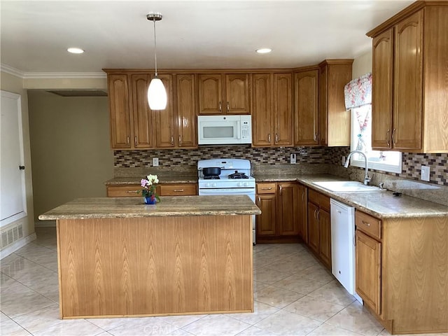 822 Greenberry Dr, La Puente, CA 91744 - kitchen with white appliances, a sink, brown cabinetry, a kitchen island, and ornamental molding