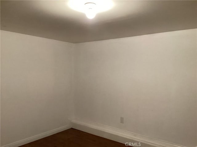 822 Greenberry Dr, La Puente, CA 91744 - spare room with baseboards and dark wood-style flooring
