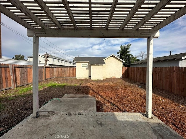 view of yard featuring a fenced backyard, a pergola, and a patio