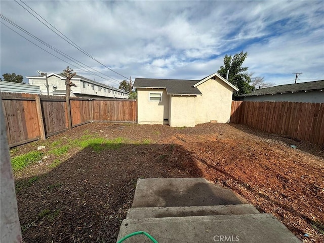 view of yard with a fenced backyard