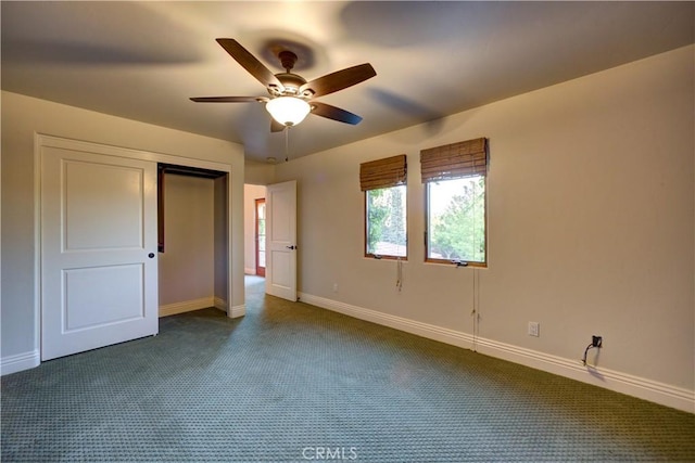 806 Vista Cerro Dr, Paso Robles, CA 93446 - unfurnished bedroom with baseboards, dark carpet, a closet, and ceiling fan