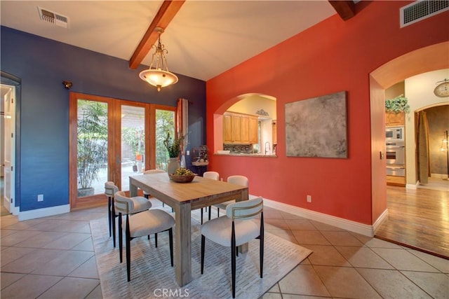 806 Vista Cerro Dr, Paso Robles, CA 93446 - dining space featuring baseboards, visible vents, arched walkways, and light tile patterned floors