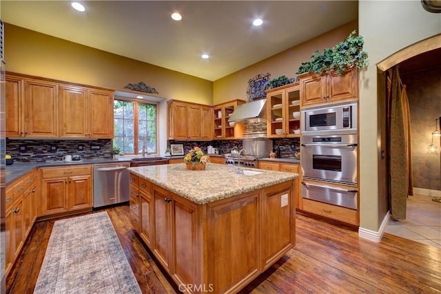 806 Vista Cerro Dr, Paso Robles, CA 93446 - kitchen with extractor fan, a warming drawer, a kitchen island, decorative backsplash, and appliances with stainless steel finishes
