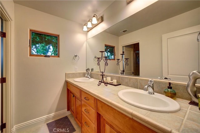 806 Vista Cerro Dr, Paso Robles, CA 93446 - full bathroom featuring double vanity, visible vents, walk in shower, and a sink