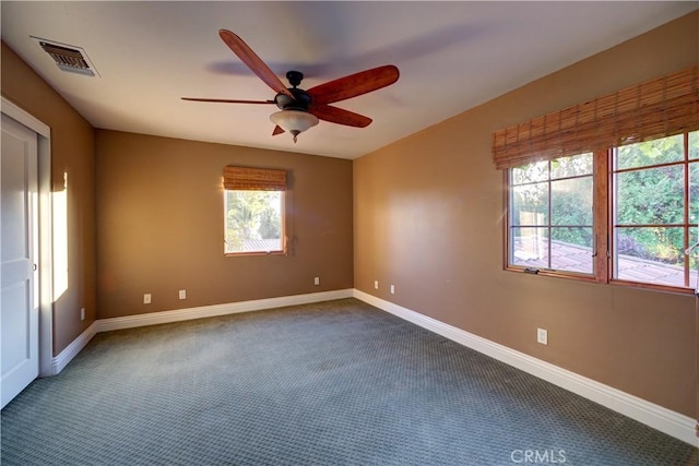 806 Vista Cerro Dr, Paso Robles, CA 93446 - spare room featuring dark carpet, baseboards, a ceiling fan, and visible vents