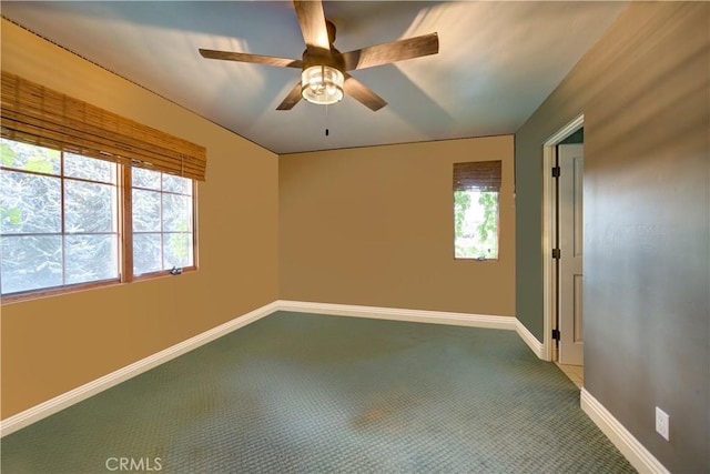 806 Vista Cerro Dr, Paso Robles, CA 93446 - spare room featuring baseboards, a ceiling fan, carpet flooring, and a wealth of natural light