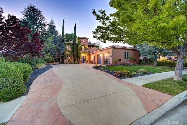 806 Vista Cerro Dr, Paso Robles, CA 93446 - mediterranean / spanish house featuring a tile roof, concrete driveway, an attached garage, a front yard, and stucco siding