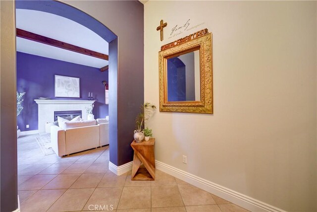 806 Vista Cerro Dr, Paso Robles, CA 93446 - corridor featuring beamed ceiling, arched walkways, baseboards, and light tile patterned floors
