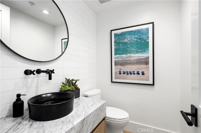 429 Marigold Ave, Corona Del Mar, CA 92625 - bathroom with tile walls, toilet, and vanity