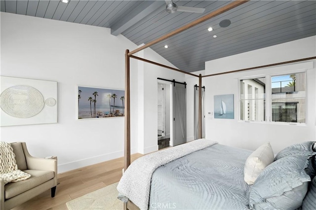 429 Marigold Ave, Corona Del Mar, CA 92625 - bedroom with wood finished floors, vaulted ceiling with beams, a barn door, baseboards, and recessed lighting
