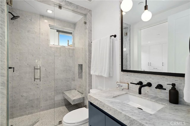 429 Marigold Ave, Corona Del Mar, CA 92625 - bathroom with a shower stall, vanity, toilet, and decorative backsplash