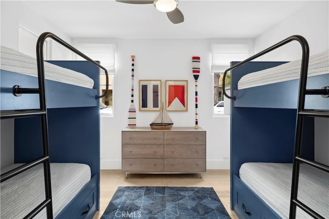 429 Marigold Ave, Corona Del Mar, CA 92625 - bedroom featuring multiple windows, baseboards, wood finished floors, and a ceiling fan