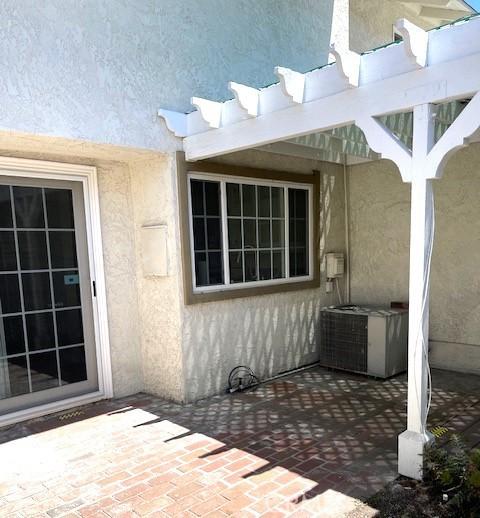 view of patio / terrace with central AC unit