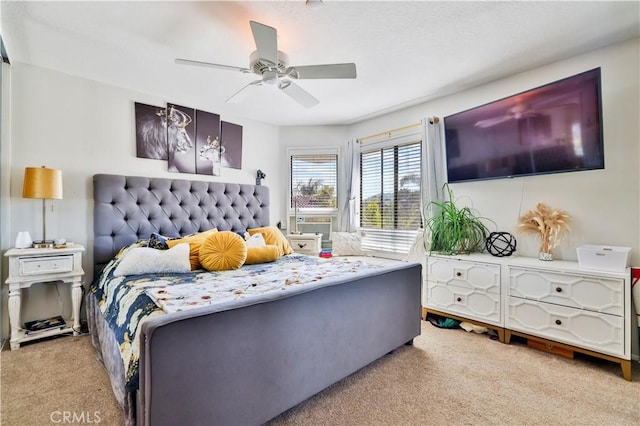 bedroom with carpet flooring, a ceiling fan, and cooling unit