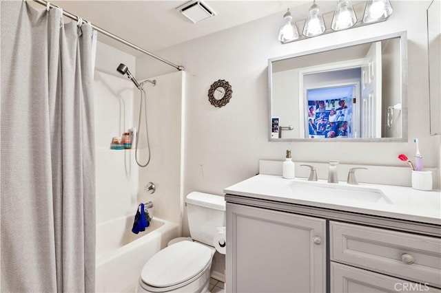full bathroom with vanity, shower / tub combo with curtain, toilet, and visible vents