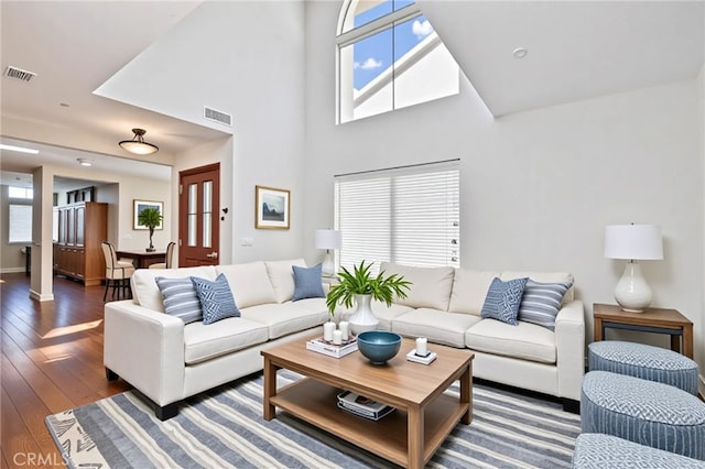 3014 Enrique Unit 98, San Clemente, CA 92673 - living area with hardwood / wood-style floors, plenty of natural light, a towering ceiling, and baseboards