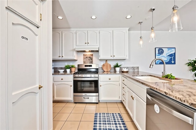 3014 Enrique Unit 98, San Clemente, CA 92673 - kitchen featuring appliances with stainless steel finishes, a sink, under cabinet range hood, light tile patterned floors, and white cabinetry