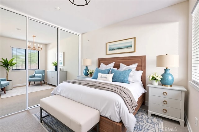 3014 Enrique Unit 98, San Clemente, CA 92673 - carpeted bedroom featuring a chandelier and baseboards