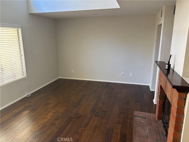 3014 Enrique Unit 98, San Clemente, CA 92673 - unfurnished living room featuring dark wood-type flooring and a fireplace