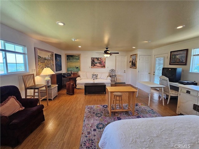 living area featuring recessed lighting, wood finished floors, and ceiling fan