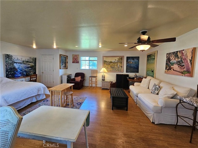 bedroom featuring a ceiling fan and wood finished floors