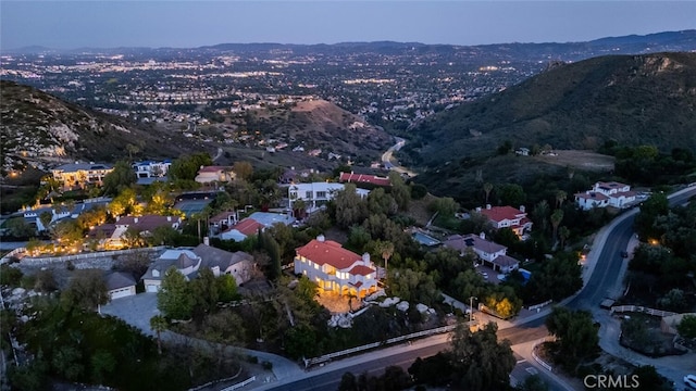 aerial overview of property's location featuring a mountain backdrop