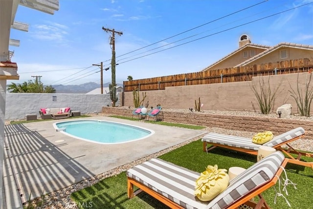 view of pool featuring a fenced backyard, a patio, and a fenced in pool