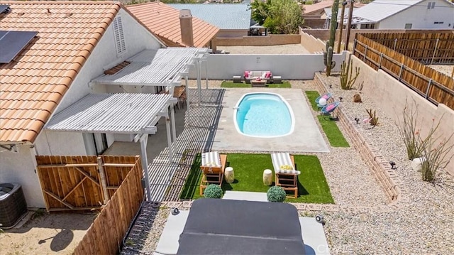 view of swimming pool featuring a fenced backyard, cooling unit, a patio, and a fenced in pool