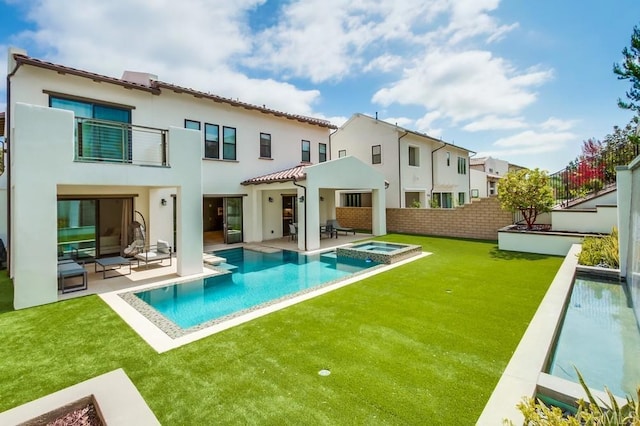 6222 Artisan Way, San Diego, CA 92130 - back of house featuring a fenced backyard, a patio, stucco siding, and a pool with connected hot tub