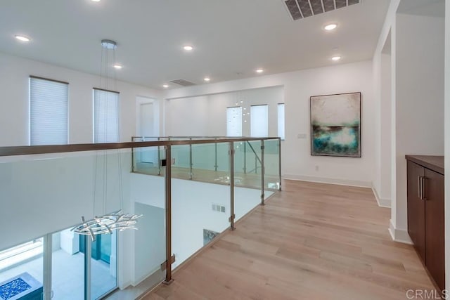 6222 Artisan Way, San Diego, CA 92130 - corridor featuring visible vents, light wood-style floors, and baseboards