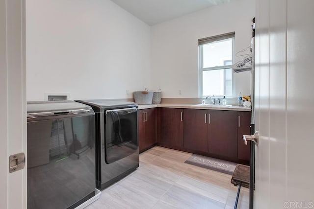 6222 Artisan Way, San Diego, CA 92130 - laundry room featuring cabinet space, washing machine and dryer, and a sink