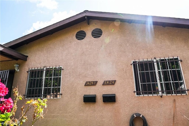 342434241/2 Paloma St, Los Angeles, CA 90011 - view of side of property with stucco siding