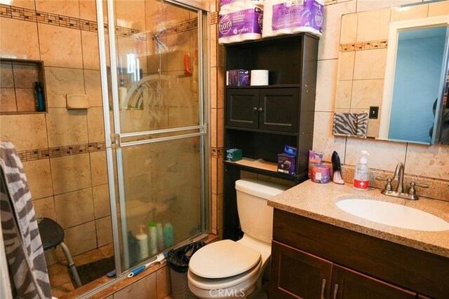 342434241/2 Paloma St, Los Angeles, CA 90011 - bathroom featuring a stall shower, toilet, and vanity