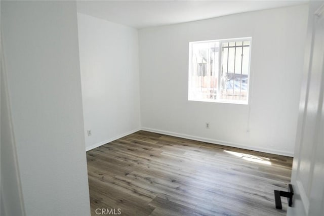 342434241/2 Paloma St, Los Angeles, CA 90011 - empty room with wood finished floors and baseboards