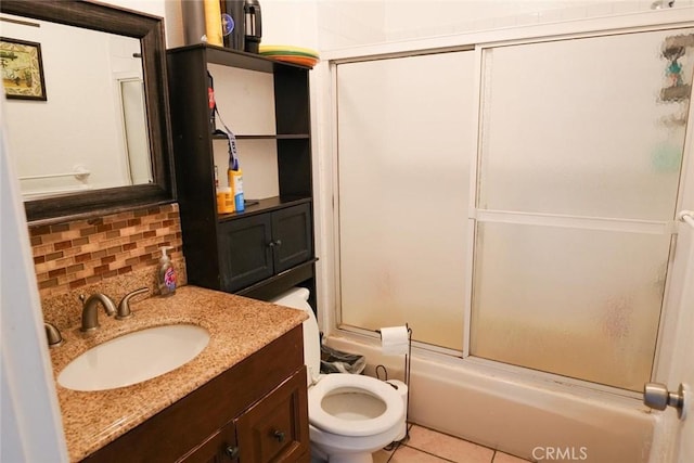 342434241/2 Paloma St, Los Angeles, CA 90011 - bathroom with shower / bath combination with glass door, decorative backsplash, tile patterned flooring, toilet, and vanity