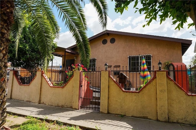 342434241/2 Paloma St, Los Angeles, CA 90011 - view of front facade with stucco siding and fence