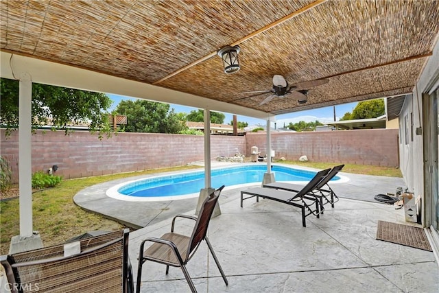 view of pool with a fenced backyard and a patio area