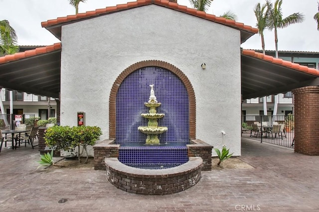 view of home's community with a patio area