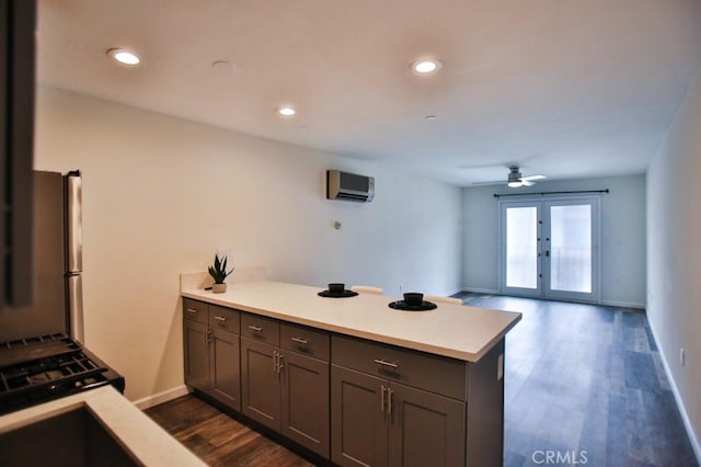 17200 Newhope St Unit 206, Fountain Valley, CA 92708 - kitchen with a peninsula, french doors, freestanding refrigerator, light countertops, and recessed lighting