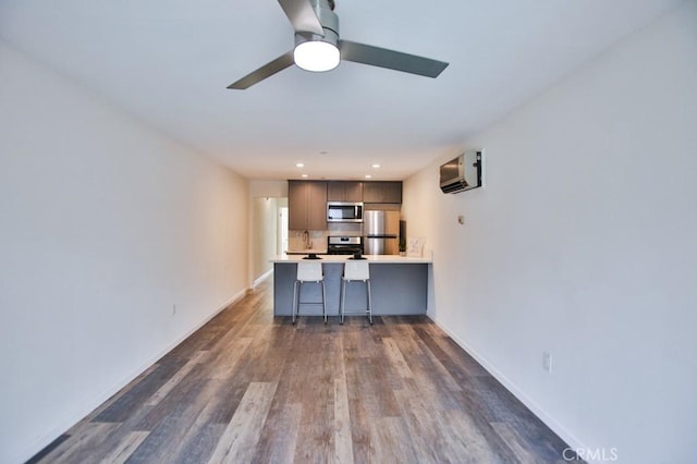 17200 Newhope St Unit 206, Fountain Valley, CA 92708 - living room with ceiling fan, dark wood finished floors, recessed lighting, and a wall mounted AC