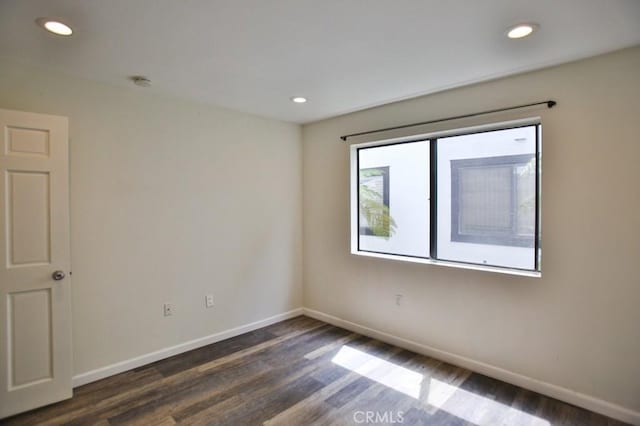 17200 Newhope St Unit 206, Fountain Valley, CA 92708 - unfurnished room featuring dark wood-style floors, recessed lighting, and a smoke detector