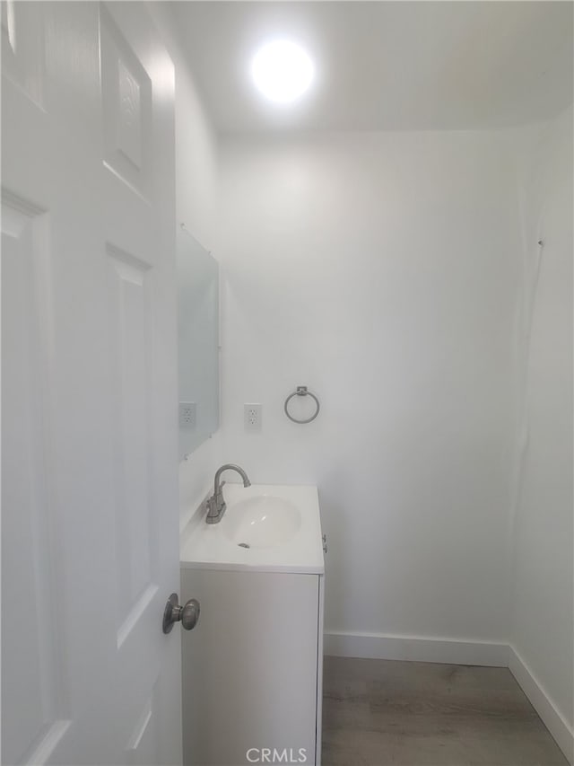 6221 Fishburn Ave, Bell, CA 90201 - bathroom with vanity and baseboards
