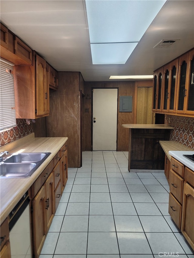 6221 Fishburn Ave, Bell, CA 90201 - kitchen with white dishwasher, a sink, glass insert cabinets, light countertops, and visible vents