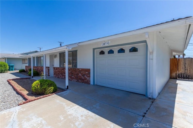 28590 Middlebury Way, Menifee, CA 92586 - ranch-style house with an attached garage, concrete driveway, and brick siding