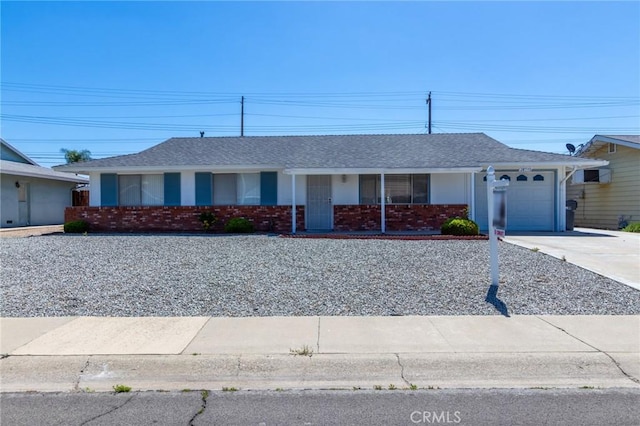 28590 Middlebury Way, Menifee, CA 92586 - ranch-style house featuring concrete driveway, an attached garage, brick siding, and roof with shingles