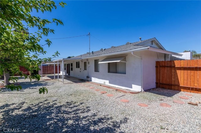 28590 Middlebury Way, Menifee, CA 92586 - back of property with stucco siding, fence, a patio, and roof with shingles